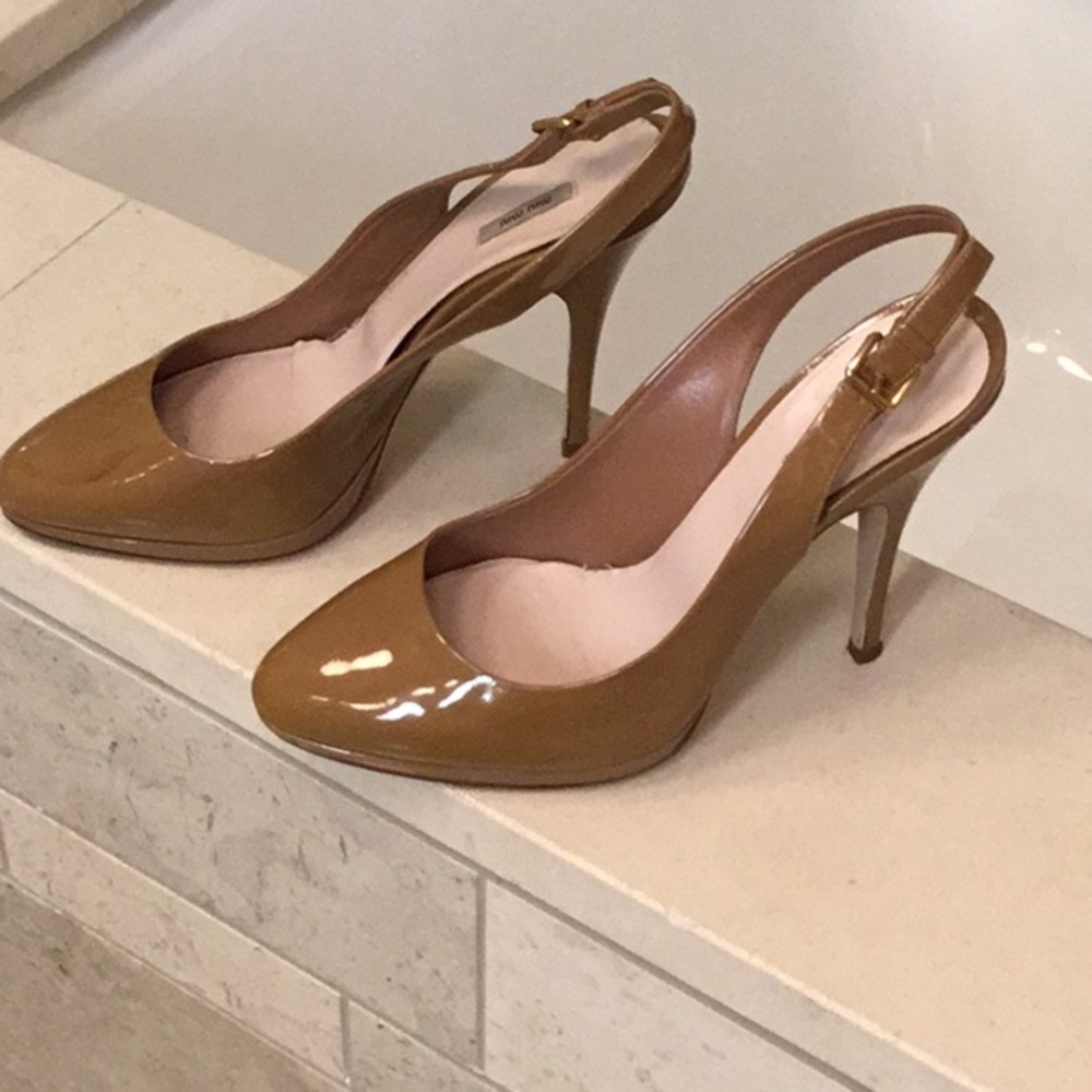 Miu Miu natural patent leather sling backs.